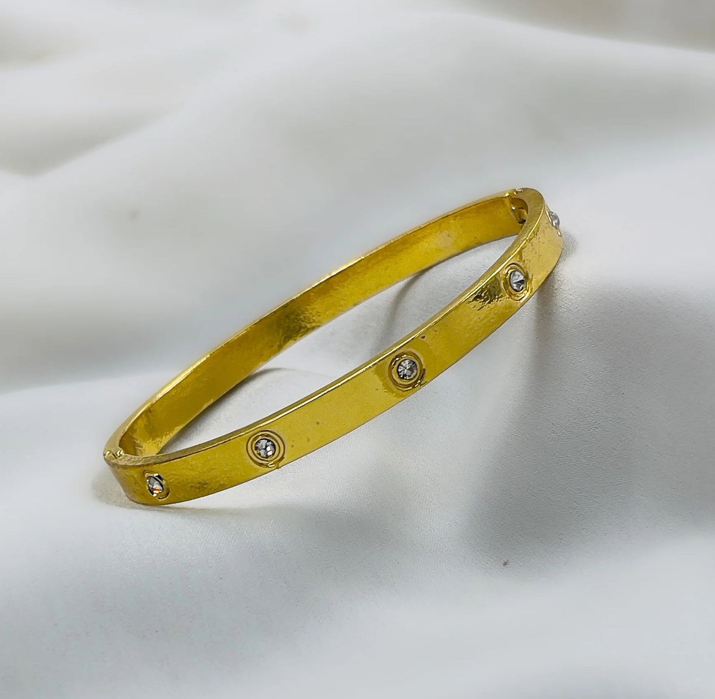 Golden Bracelet with Synthetic/Imitation Stone – Elegance Redefined